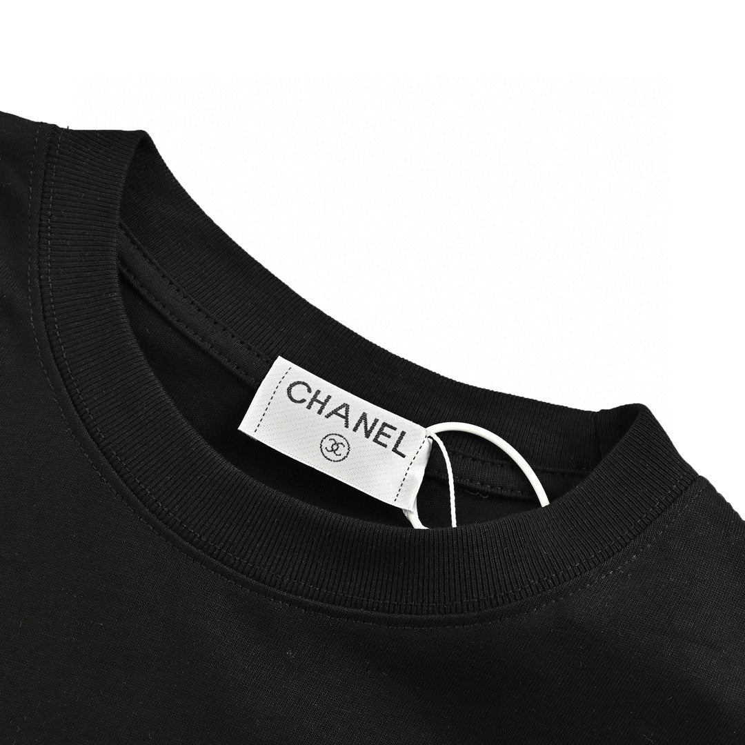 Chanel T-shirt - Black Unisex Streetwear Limited Edition - This Chanel t-shirt features a minimalist black design. It has a subtle graphic on the