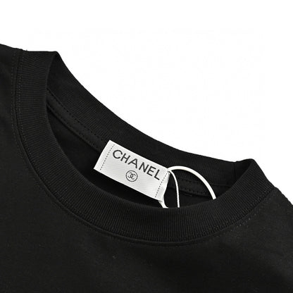 Chanel T-shirt - Black Unisex Streetwear Limited Edition - This Chanel t-shirt features a minimalist black design. It has a subtle graphic on the