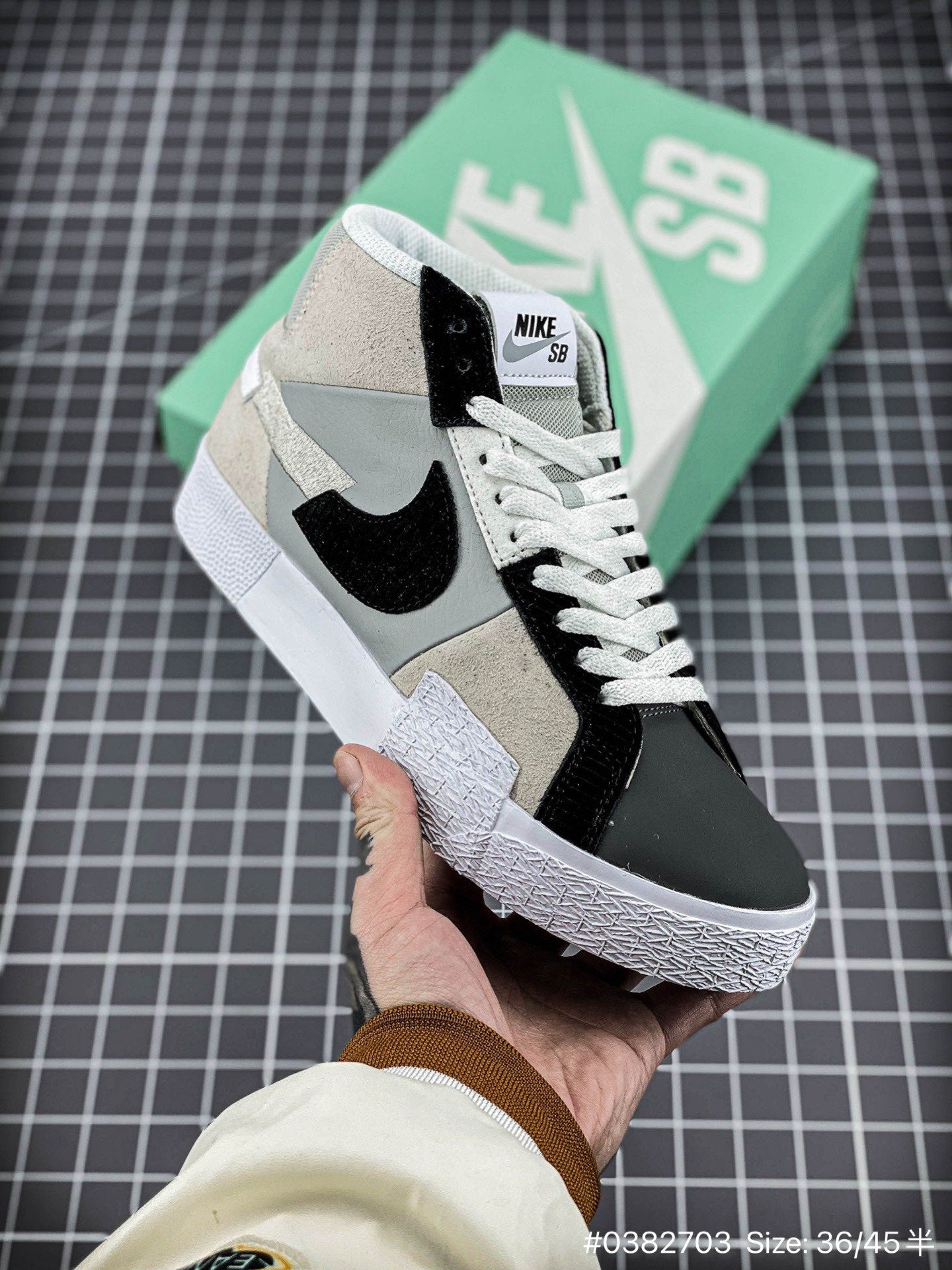Nike Blazer Mid'1977 - Black Unisex Streetwear Limited Edition - The Nike Blazer High-Top '1977 'Mismatched Swoosh' in Grey and Black offers a bold and