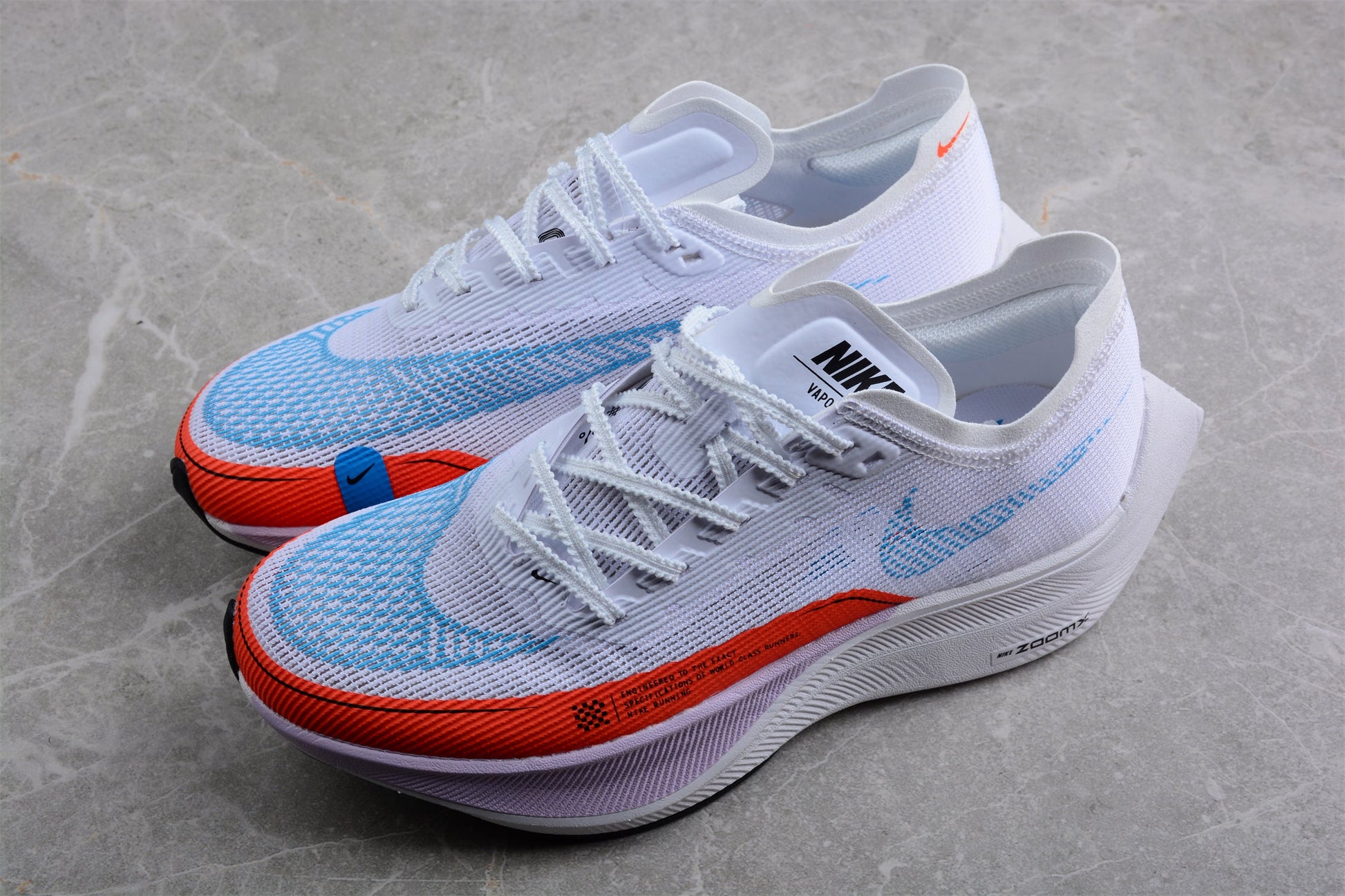 Zoom - Vaporfly Ne - T% 2 And Orange - White Unisex Streetwear Limited Edition - The Nike ZoomX Vaporfly NEXT% 2 is a high-performance running shoe designed for elite runners.