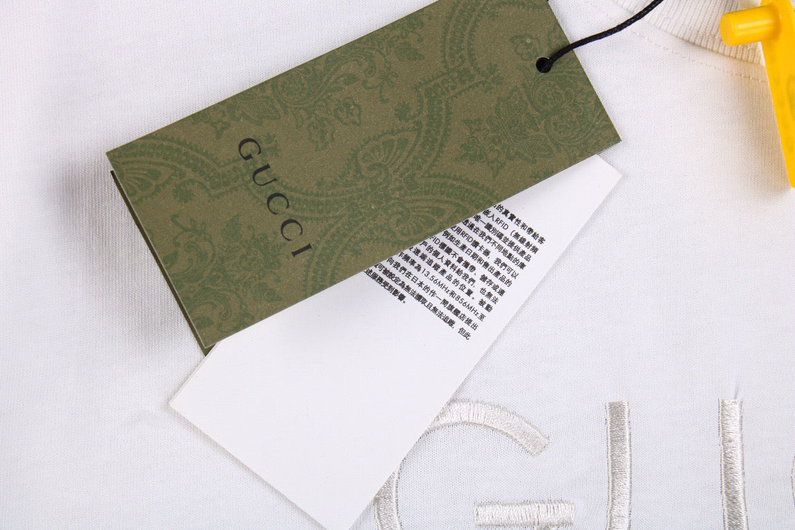Gucci T-shirt With Embroidered Cities Unisex Streetwear Limited Edition - <p dir='ltr'><span>White t-shirt featuring subtle embroidered text with the cities 'FIRENZE-ROMA-MILANO-NEW YORK' under the