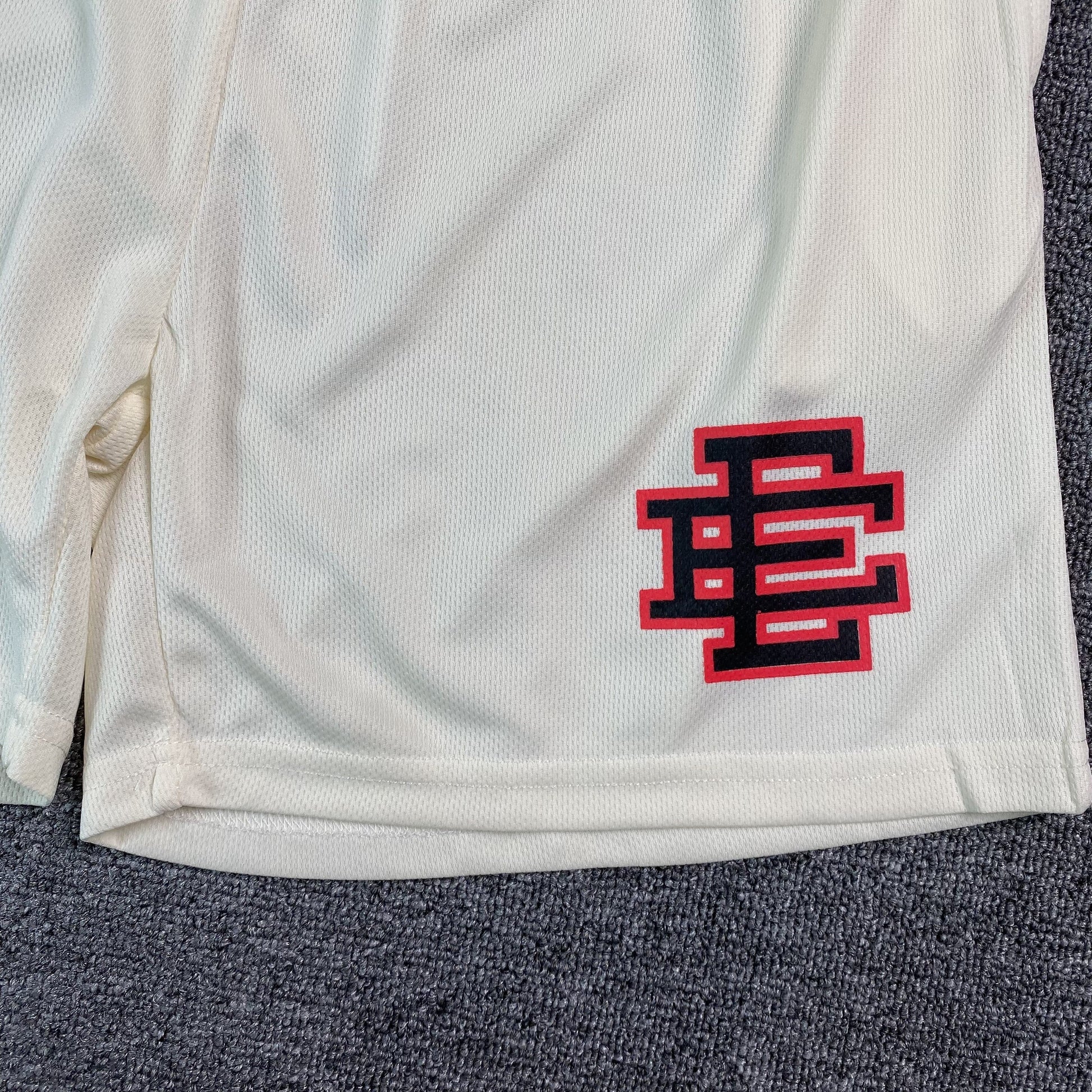 ERIC Emanuel Ee Basic Shorts Cream - - Red - Black Unisex Streetwear Limited Edition - The ERIC EMANUEL EE BASIC SHORTS CREAM/BLACK/RED - REPLICA bring together luxury streetwear aesthetics and