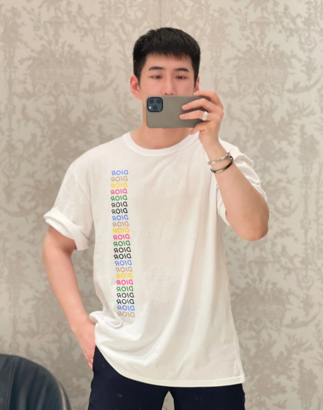 Dior T-shirt - Multicolor Vertical Logo - White Unisex Streetwear Limited Edition - <span>This Dior t-shirt features a sleek white base with a vibrant multicolor 'DIOR' logo repeated
