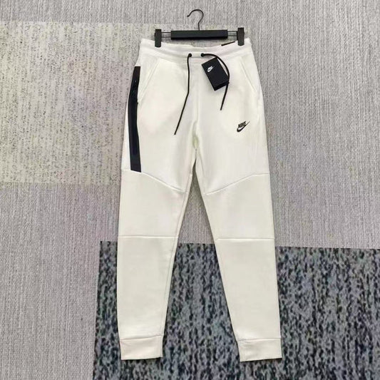 NIKE Tech Fleece Pants - - Grey - White Unisex Streetwear Limited Edition - The NIKE TECH FLEECE PANTS WHITE/GREY - REPLICA offer the perfect combination of modern athletic