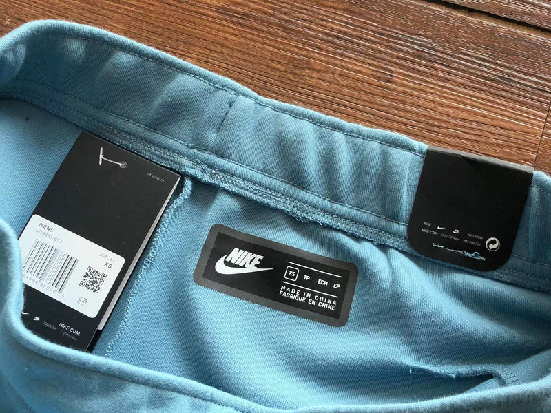 PANTALON EN FUZILLE TECH DE NIKE x BLEU BEBÉ