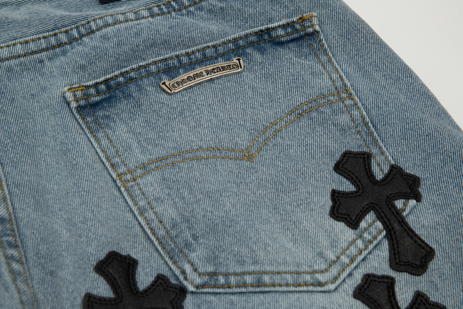 CHROME HEARTS BLACK CROSS PATCH JORTS WASHED DENIM - close up - replica sneakers