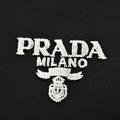 Prada T-shirt - Black Unisex Streetwear Limited Edition - This Prada t-shirt features a minimalist black design. It has the Prada Milano logo printed