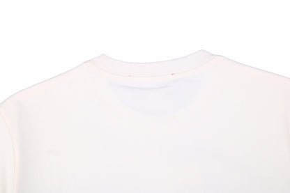 Camiseta Gucci con logo de rayo en color crema