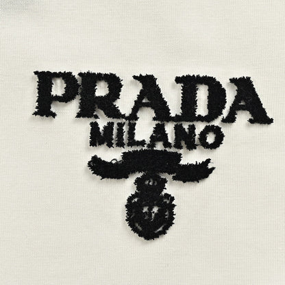 Prada T-shirt - Black Unisex Streetwear Limited Edition - This Prada t-shirt features a minimalist white design. It has the Prada Milano logo printed