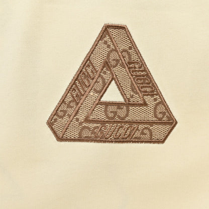 Gucci Triangle Logo T-shirt - Beige Unisex Streetwear Limited Edition - This Gucci t-shirt features a subtle triangle logo on the chest. The shirt is primarily
