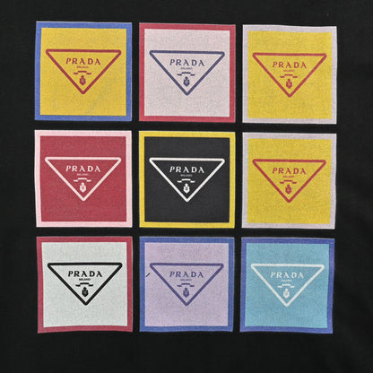 Prada Pop Art Logo T-shirt (black) Unisex Streetwear Limited Edition - The Prada Pop Art Logo T-Shirt in black features a playful and colorful design inspired
