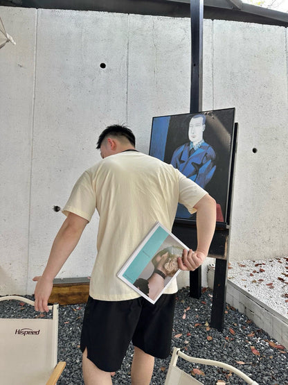 Camiseta Dior color crema con ribete negro