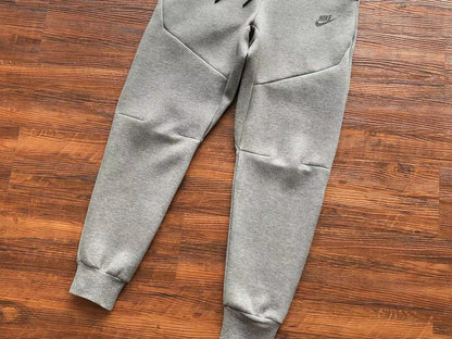 NIKE Tech Fleece Pants - Wolf - Grey Unisex Streetwear Limited Edition - The NIKE TECH FLEECE PANTS WOLF GREY - REPLICA blend modern athletic performance with sleek