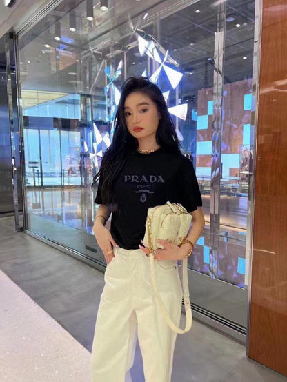 Prada T-shirt - With Subtle Branding - Black Unisex Streetwear Limited Edition - <span>This Prada t-shirt features a sleek black base with understated 'PRADA MILANO' branding across the
