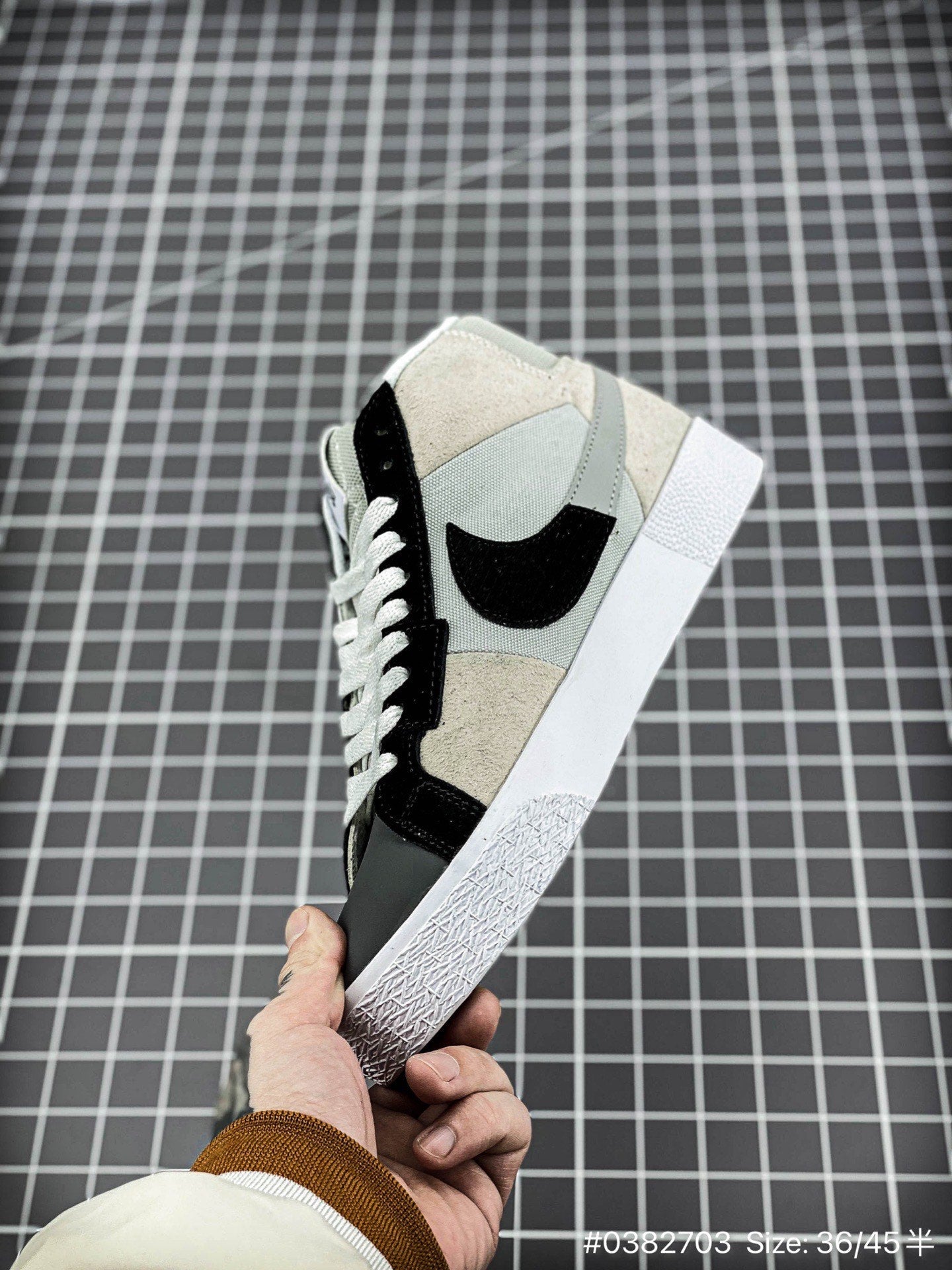 Nike Blazer Mid'1977 - Black Unisex Streetwear Limited Edition - The Nike Blazer High-Top '1977 'Mismatched Swoosh' in Grey and Black offers a bold and