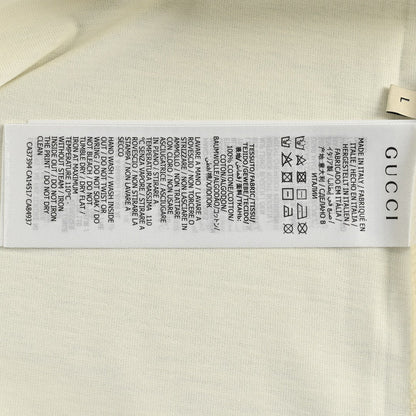 Camiseta color crema con gráfico de Gucci