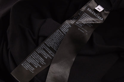 Camiseta negra con logo caligráfico de Balenciaga