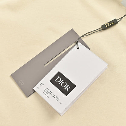 Camiseta Dior color crema con ribete negro