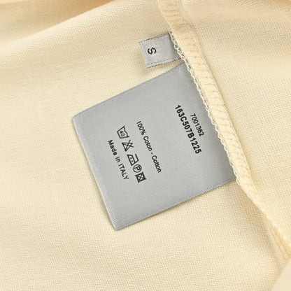 Dior Cream T-shirt With Trim - Black Unisex Streetwear Limited Edition - <span>This Dior t-shirt features a minimalist design with a cream-colored cotton fabric and black trim