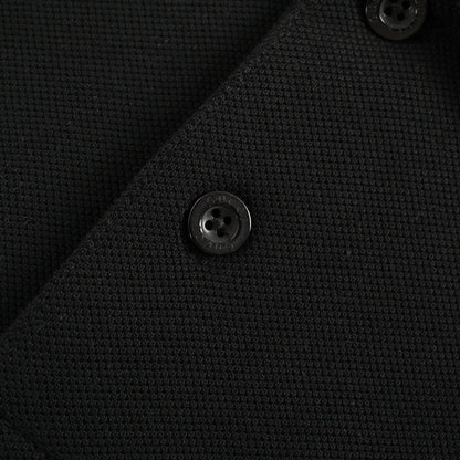 Polo con logo de llamas de Gucci