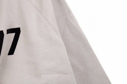 Fear of God Essentials '1977' Sweatshirt - close up - replica sneakers