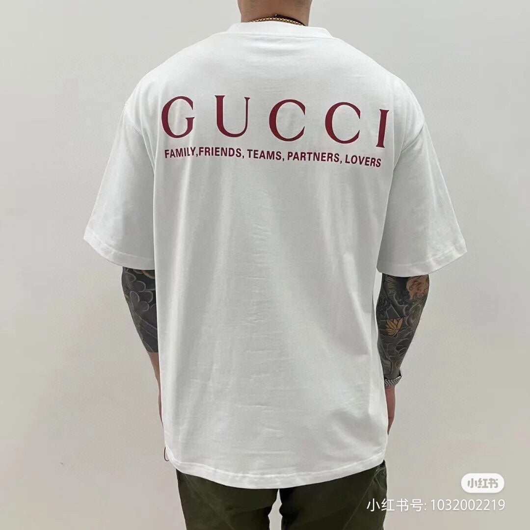 Gucci Ancor. T-shirt (white) Unisex Streetwear Limited Edition - <span>Stylish white t-shirt featuring a red 'GUCCI ANCOR.' graphic with event details on the chest.