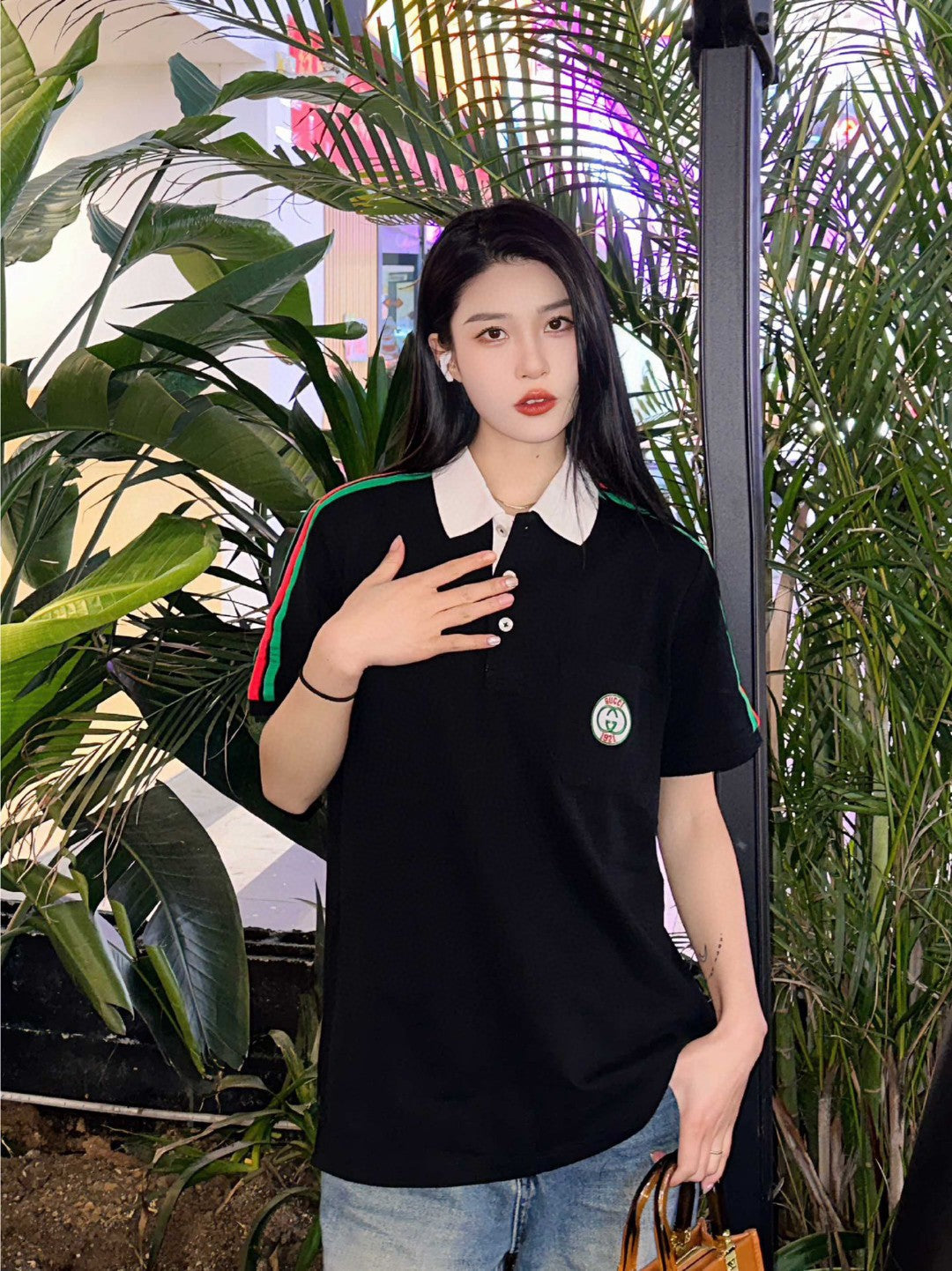 Gucci Stripe Sleeve Polo Shirt - Black Unisex Streetwear Limited Edition - <span>This Gucci polo shirt features a sleek black color with the iconic green and red