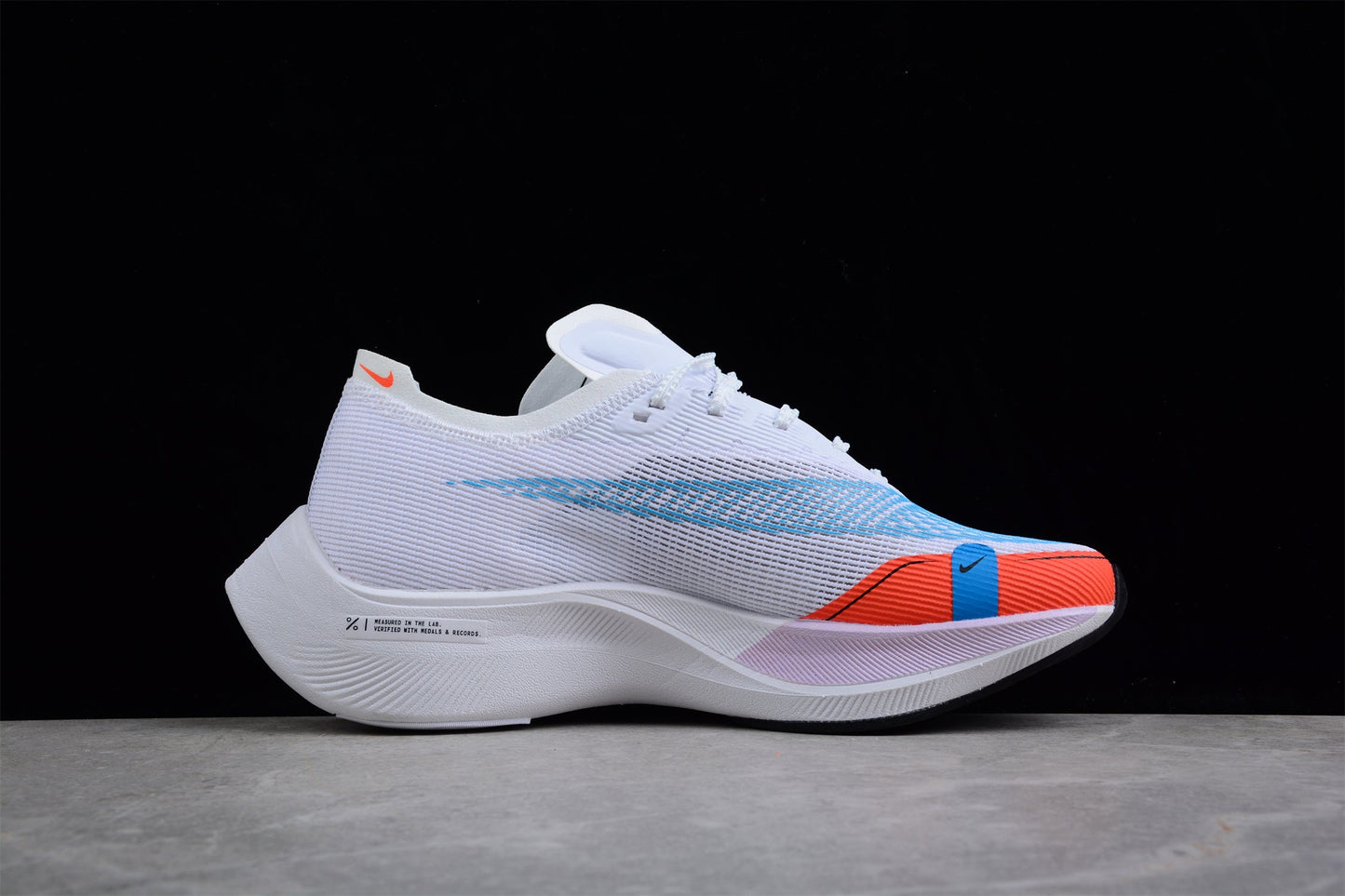Zoom - Vaporfly Ne - T% 2 And Orange - White Unisex Streetwear Limited Edition - The Nike ZoomX Vaporfly NEXT% 2 is a high-performance running shoe designed for elite runners.