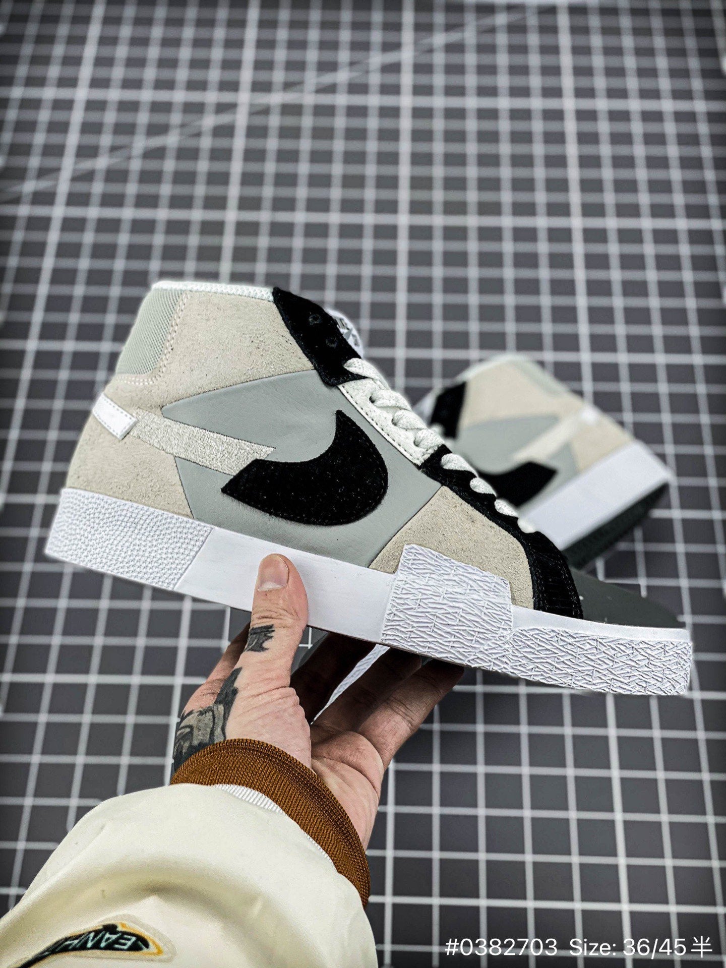 Nike Blazer Mid'1977 - Black Unisex Streetwear Limited Edition - The Nike Blazer High-Top '1977 'Mismatched Swoosh' in Grey and Black offers a bold and