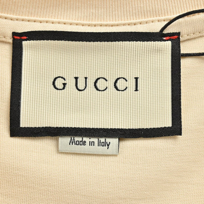 Camiseta Gucci con logo salpicado (Beige)