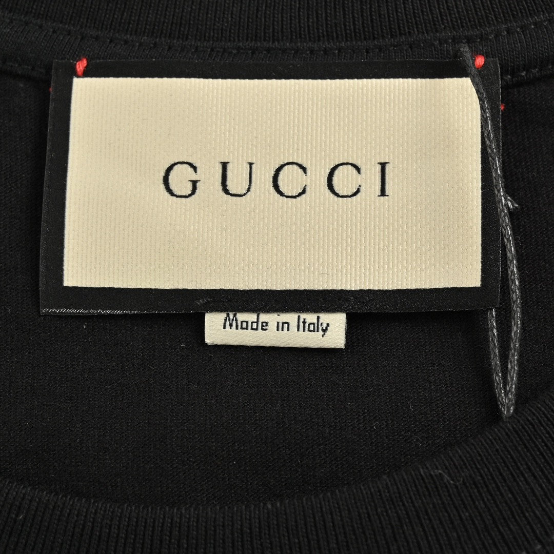 Gucci T-shirt With Pink Dinosaur Graphic - Black Unisex Streetwear Limited Edition - <span>Fun and trendy. Features colorful pink dinosaur cartoons. Gucci logo in the center. Made from