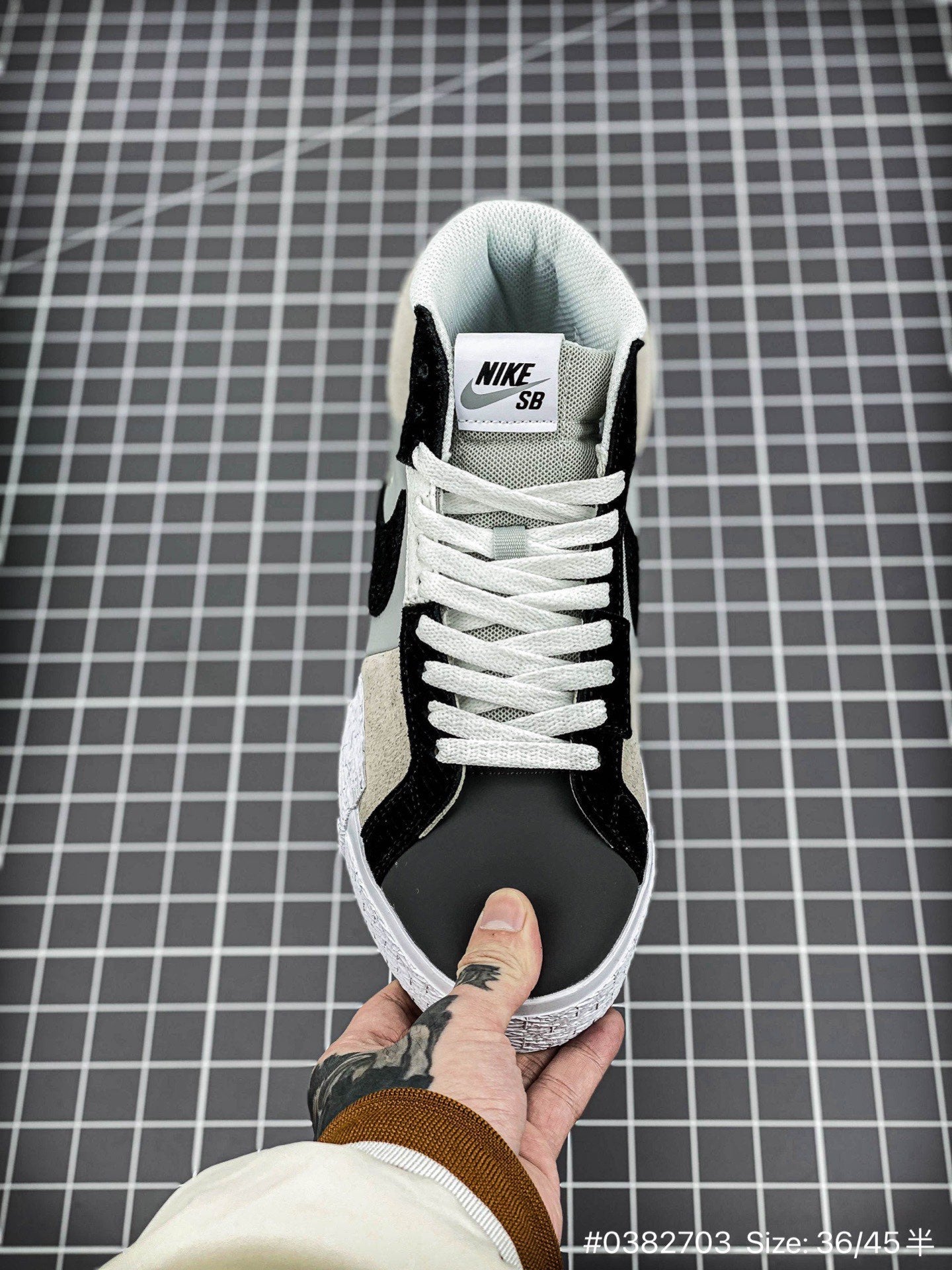 Nike Blazer Mid'1977 - Black Unisex Streetwear Limited Edition - The Nike Blazer High-Top '1977 'Mismatched Swoosh' in Grey and Black offers a bold and