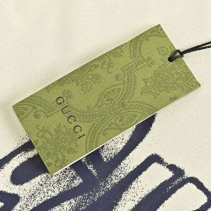 Gucci Graphic T-shirt - Cream Unisex Streetwear Limited Edition - <span>This Gucci t-shirt features a striking graphic design with the Gucci logo displayed in a