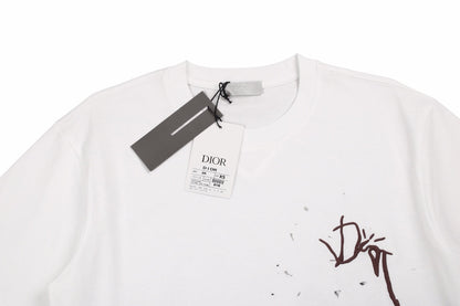 Dior T-shirt With Logo - Brown Unisex Streetwear Limited Edition - <p dir='ltr'><span>White t-shirt featuring a brown Dior logo with a splattered paint effect. Bold