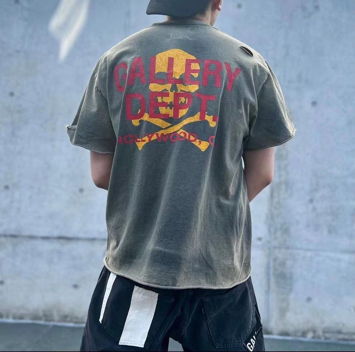 GALLERY Dept. Zip Tee T-Shirt - Red Unisex Streetwear Limited Edition - **Gallery Dept. Hollywood Skull Tee** The Gallery Dept. Hollywood Skull Tee is an eye-catching piece