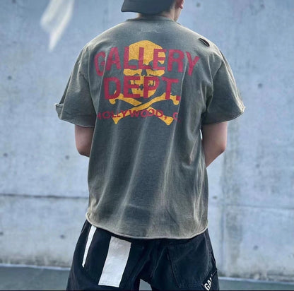 GALLERY Dept. Zip Tee T-Shirt - Red Unisex Streetwear Limited Edition - **Gallery Dept. Hollywood Skull Tee** The Gallery Dept. Hollywood Skull Tee is an eye-catching piece