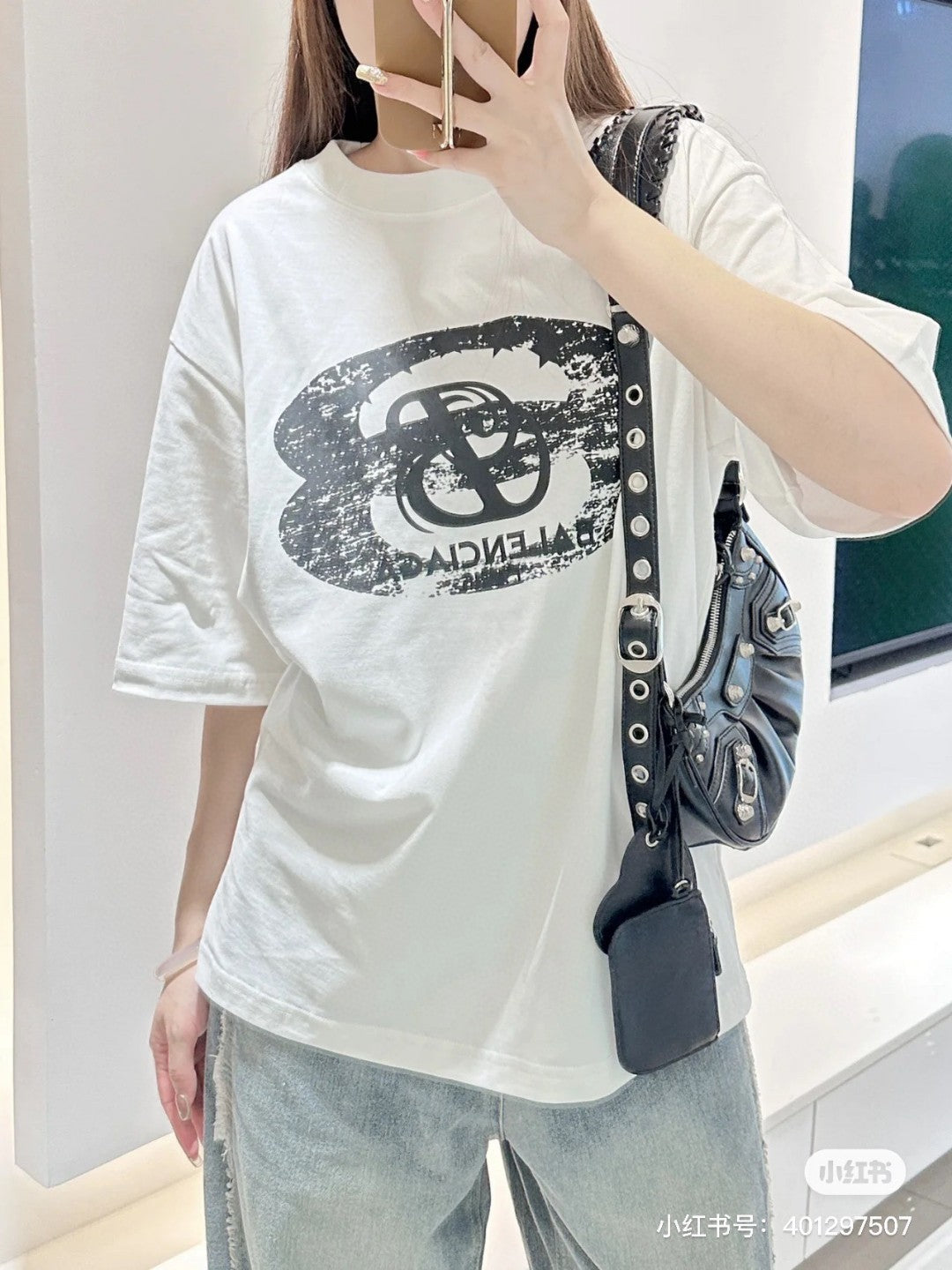 Balenciaga T-shirt - Distressed Logo - Black Unisex Streetwear Limited Edition - <span>This Balenciaga t-shirt features a bold design with a distressed, black graphic logo on the