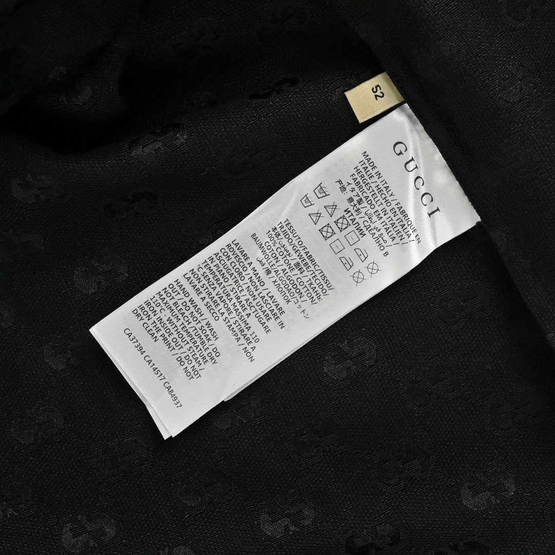 Camisa negra de manga corta con monograma GG de Gucci