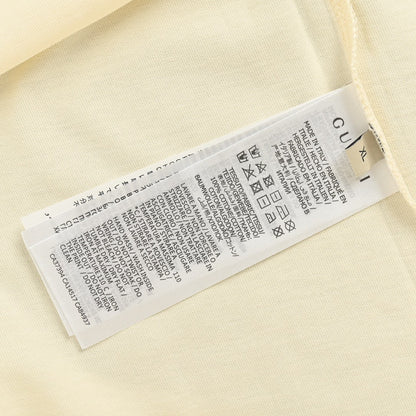 Camiseta beige con logo triangular de Gucci