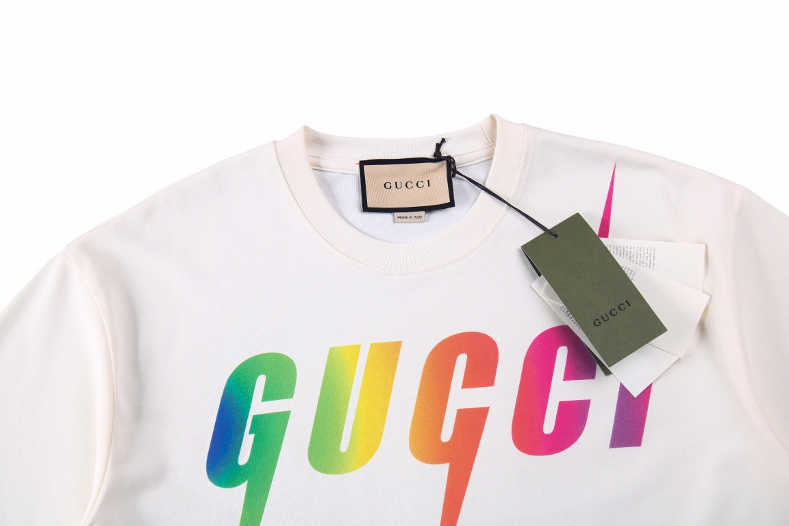 Gucci Rainbow Lightning T-shirt (white) Unisex Streetwear Limited Edition - <span>Stylish white t-shirt featuring a bold, rainbow-colored Gucci logo with striking lightning bolt accents. Made