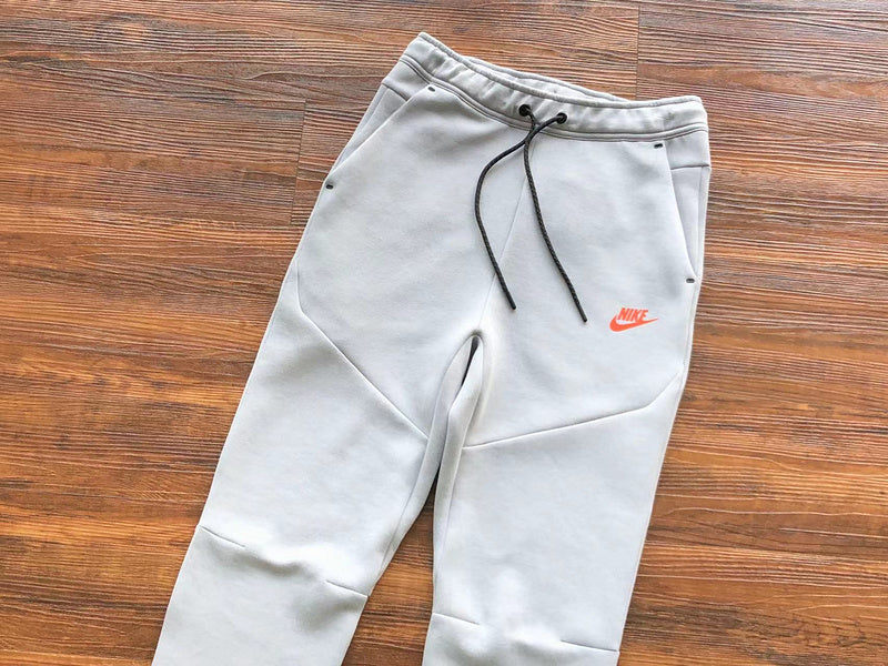 NIKE TECH FLEECE PANTS x WOLF GREY/AQUAMARINE/ORANGE - close up - replica sneakers