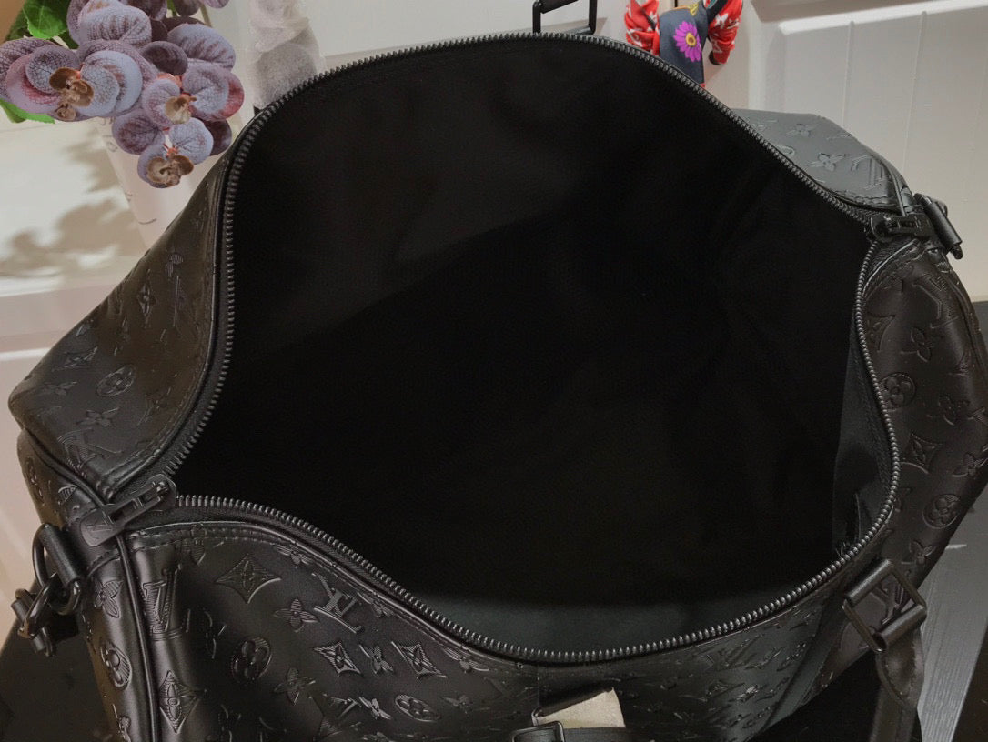 LOUIS VUITTON KEEPBALL 50 BLACK LEATHER TRAVEL BAG - close up - replica sneakers