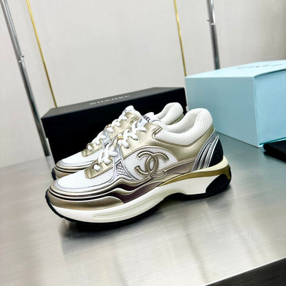 CHANEL Cc Runners Sneakers And Gold - White Unisex Streetwear Limited Edition - The CHANEL CC RUNNERS SNEAKERS WHITE &amp; GOLD - REPLICA bring together luxury, elegance, and