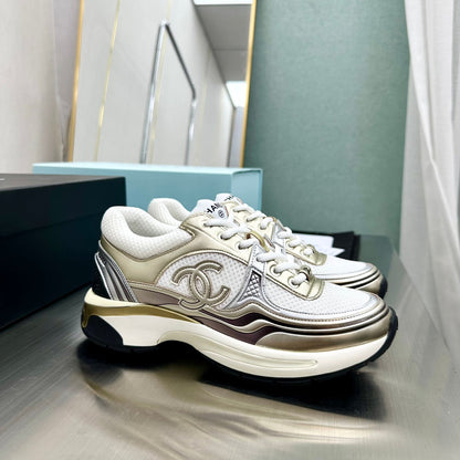 CHANEL Cc Runners Sneakers And Gold - White Unisex Streetwear Limited Edition - The CHANEL CC RUNNERS SNEAKERS WHITE &amp; GOLD - REPLICA bring together luxury, elegance, and