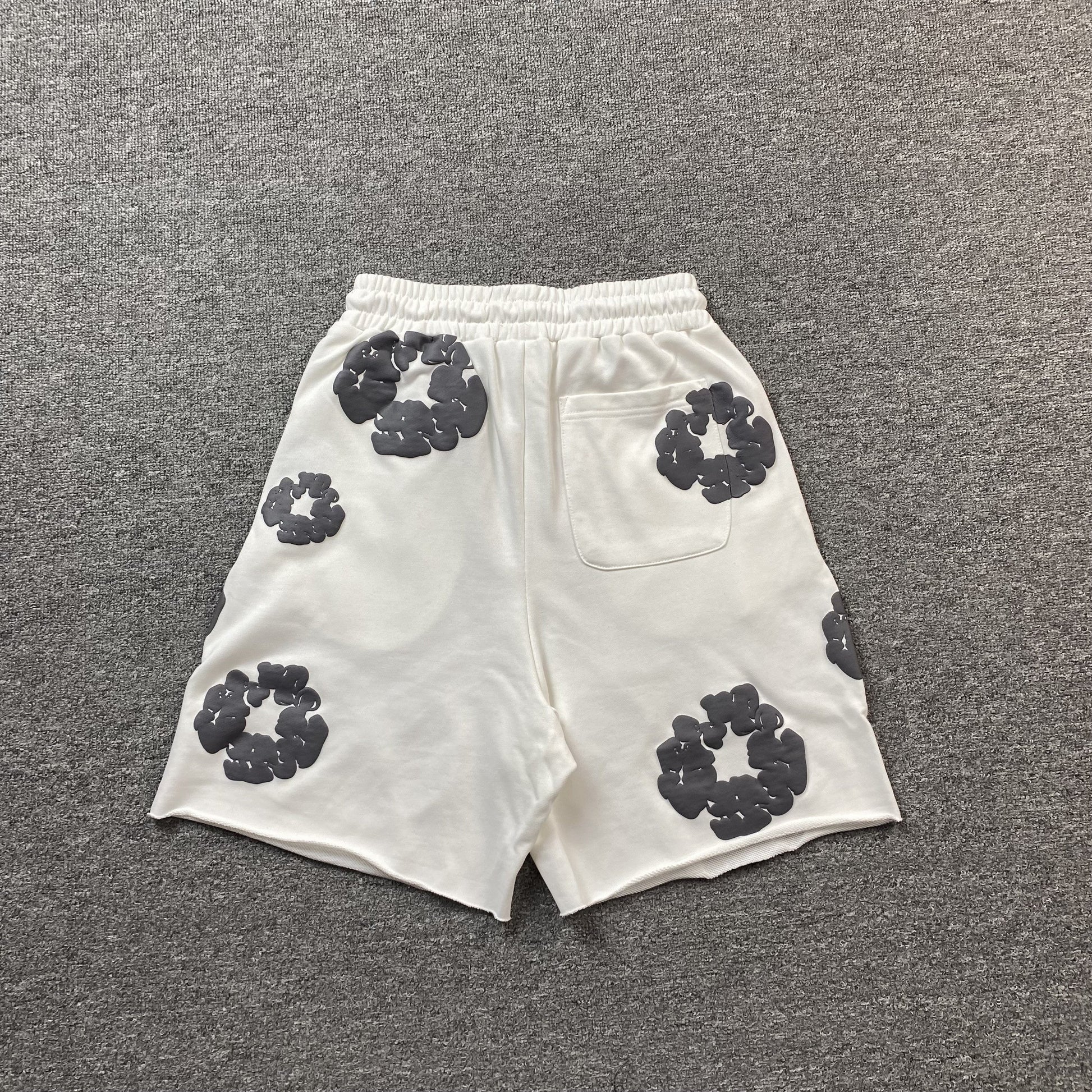 DENIM Tears Cotton Wreath Shorts - White Unisex Streetwear Limited Edition - The DENIM TEARS COTTON WREATH SHORTS WHITE - REPLICA offer a fresh and clean take