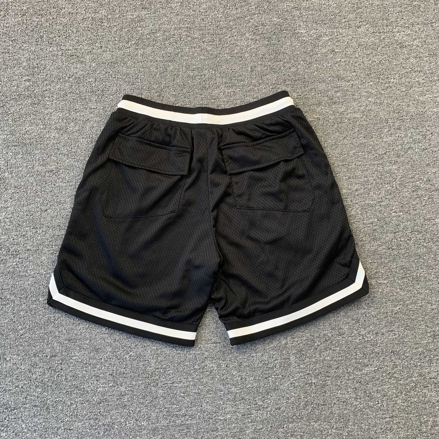 RHUDE Court Logo Shorts - White - Black Unisex Streetwear Limited Edition - The RHUDE COURT LOGO SHORTS BLACK/WHITE - REPLICA combine vintage basketball aesthetics with high-end streetwear