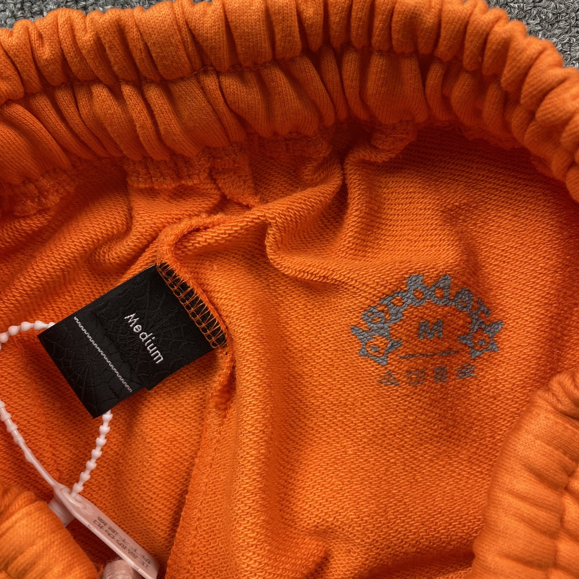 SP5DER Legacy Sweatpants - Orange Unisex Streetwear Limited Edition - The SP5DER LEGACY SWEATPANTS ORANGE - REPLICA are the perfect fusion of bold streetwear aesthetics
