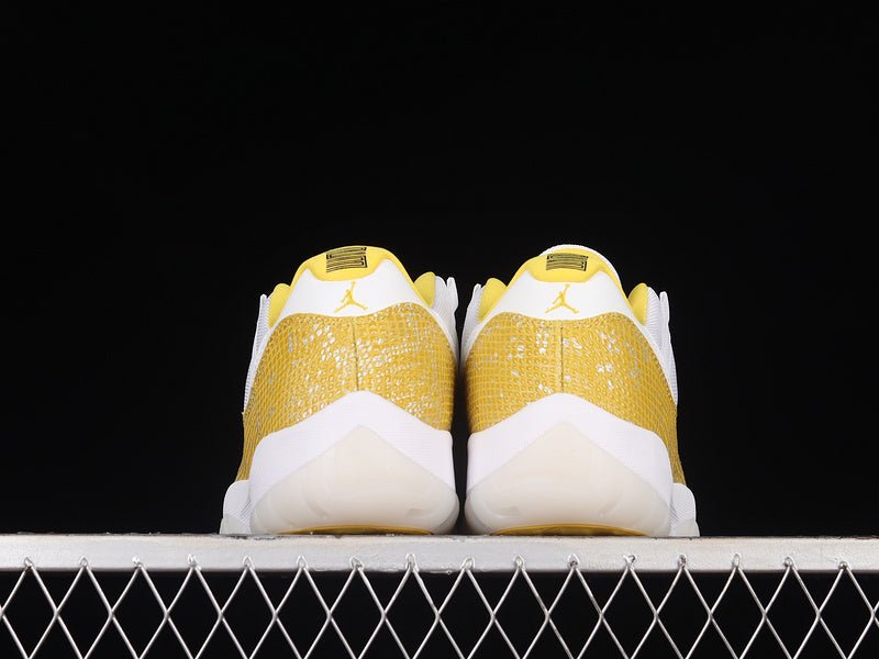 AIR Jordan 11 Low Yellow Snakeskin Sneakers - White Unisex Streetwear Limited Edition - Embrace bold sophistication with the Air Jordan 11 Low Yellow Snakeskin White/Tour Yellow/Sail, a striking
