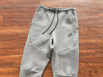 NIKE Tech Fleece Pants - Wolf - Grey Unisex Streetwear Limited Edition - The NIKE TECH FLEECE PANTS WOLF GREY - REPLICA blend modern athletic performance with sleek