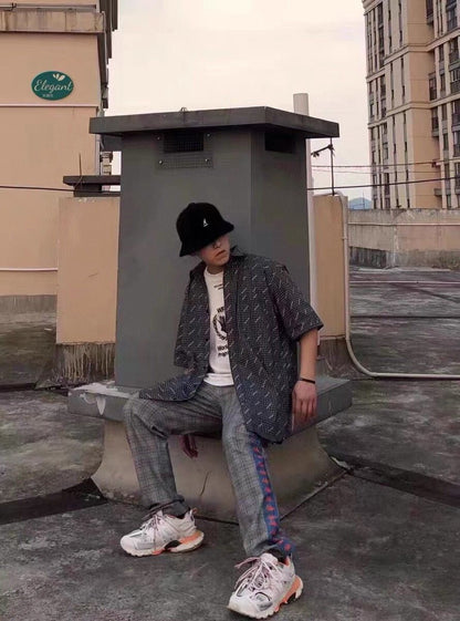 Chemise à carreaux à logo intégral de Balenciaga